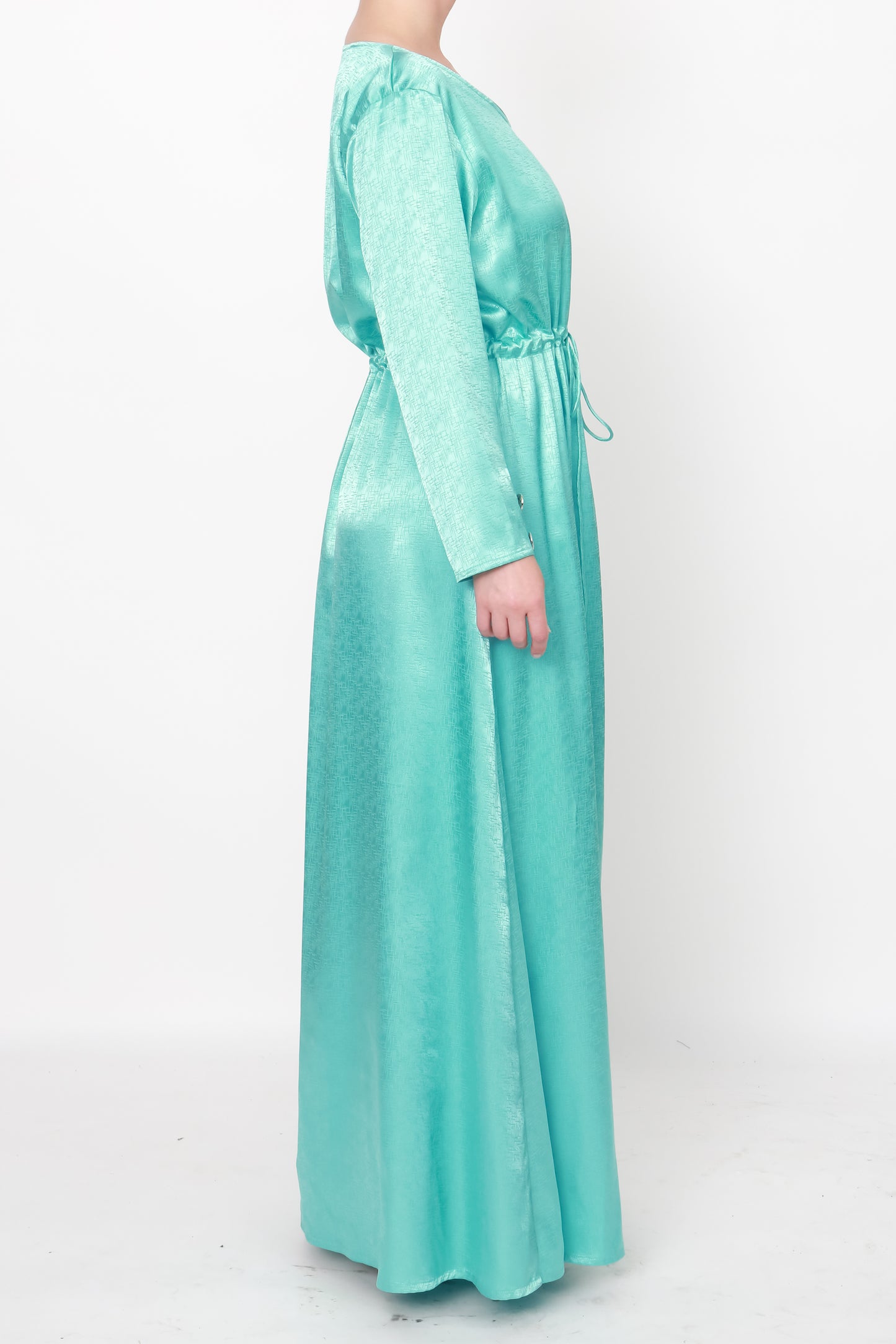 Sophisticated aquamarine silk dress featuring exquisite jacquard fabric, V-neckline, drawstring waist, and placket cuffs with silver buttons.