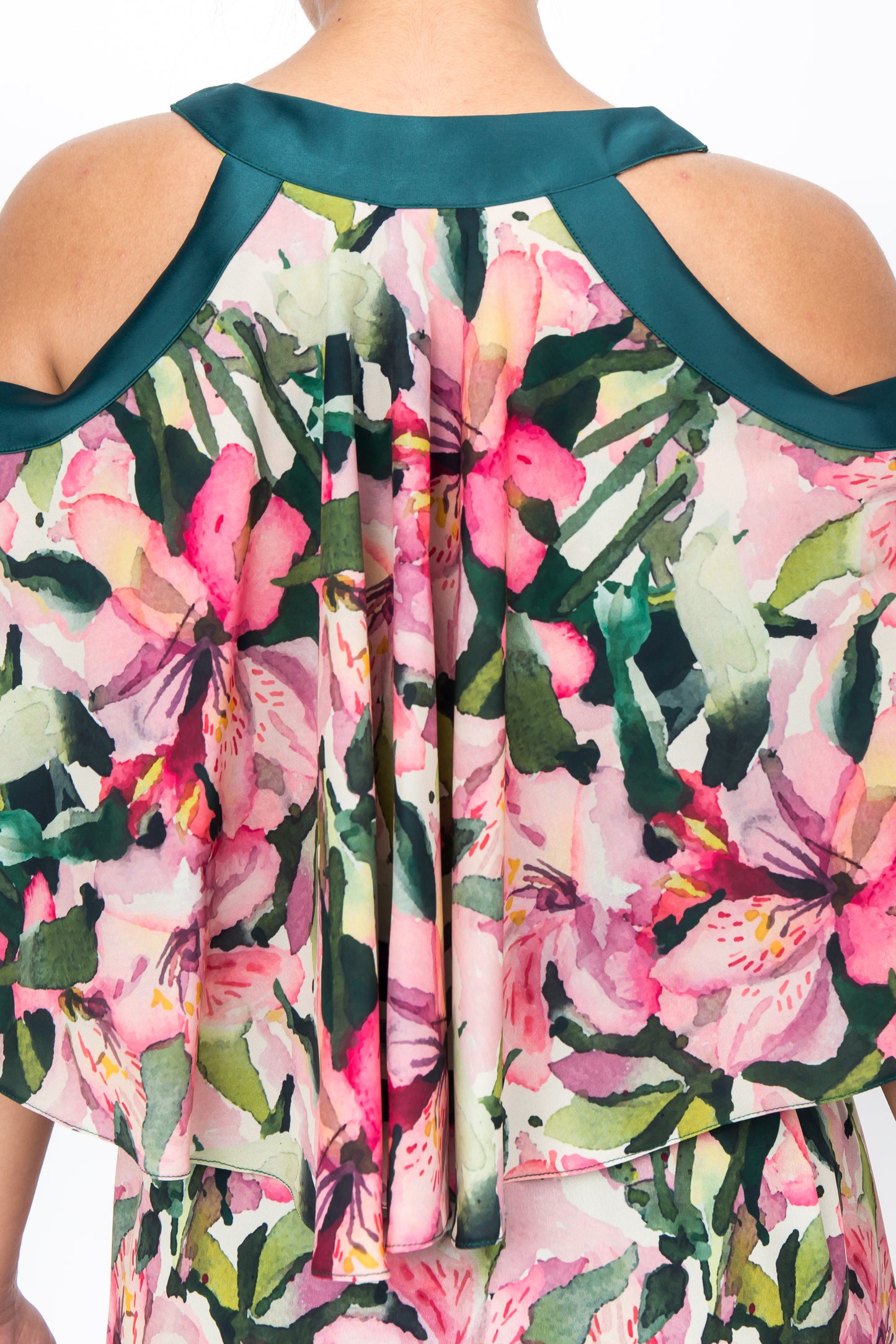 Back view of Eye-catching tropical print dress made from luxurious silk with a flattering V-neckline and cut-away shoulders.