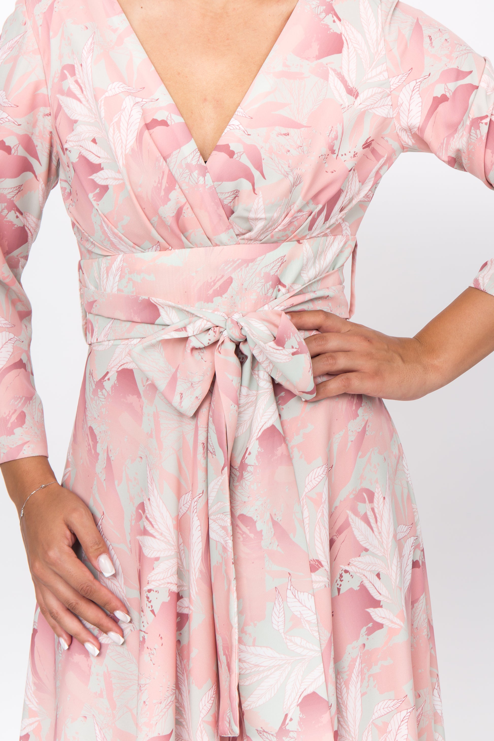 Unique floral print of the peach silk dress, adding a touch of elegance to the overall look