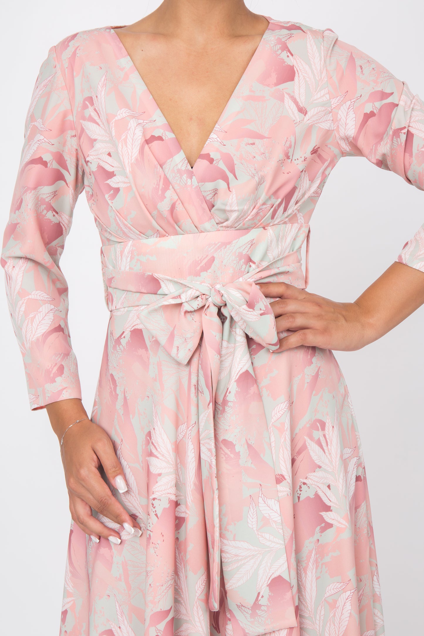 Unique floral print of the peach silk dress, adding a touch of elegance to the overall look