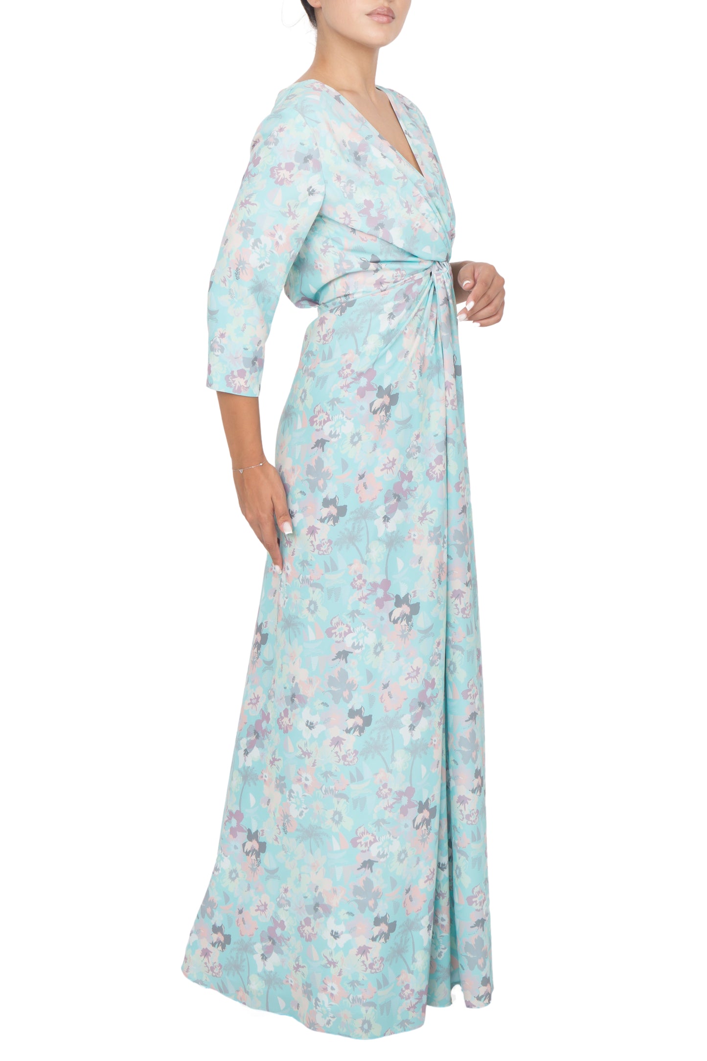 Three-quarter straight sleeves of the blue floral dress, adding a touch of elegance to the overall look