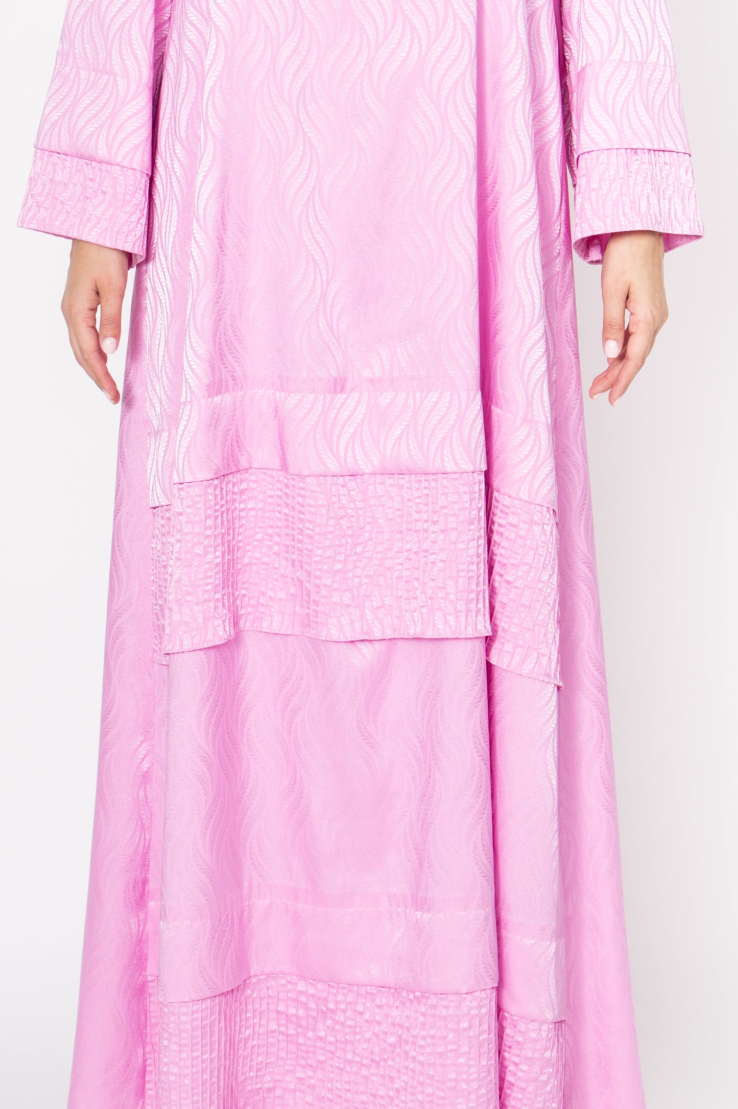 Stylish pink dress with intricate pinstripe stitching and fold design