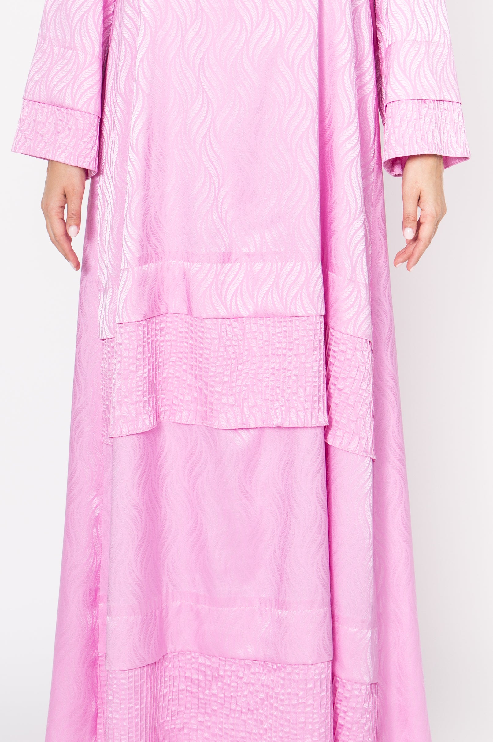 Stylish pink dress with intricate pinstripe stitching and fold design