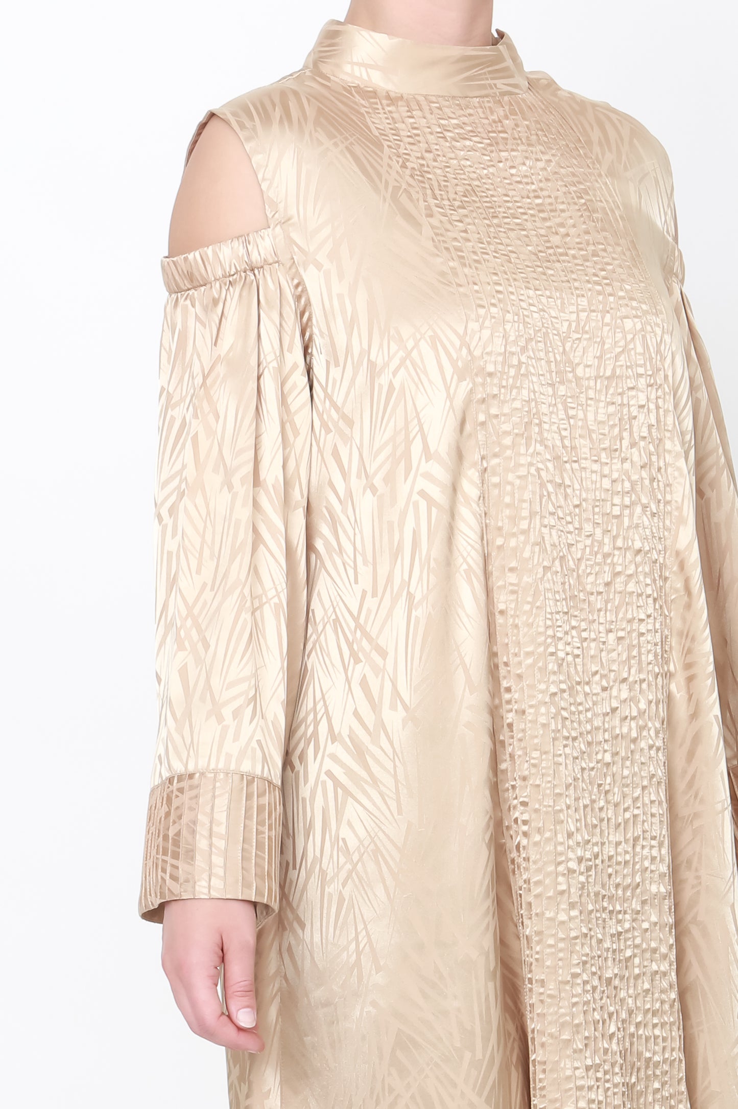 Loose-fitting beige dress with cold shoulder sleeves and pinstripe cuffs