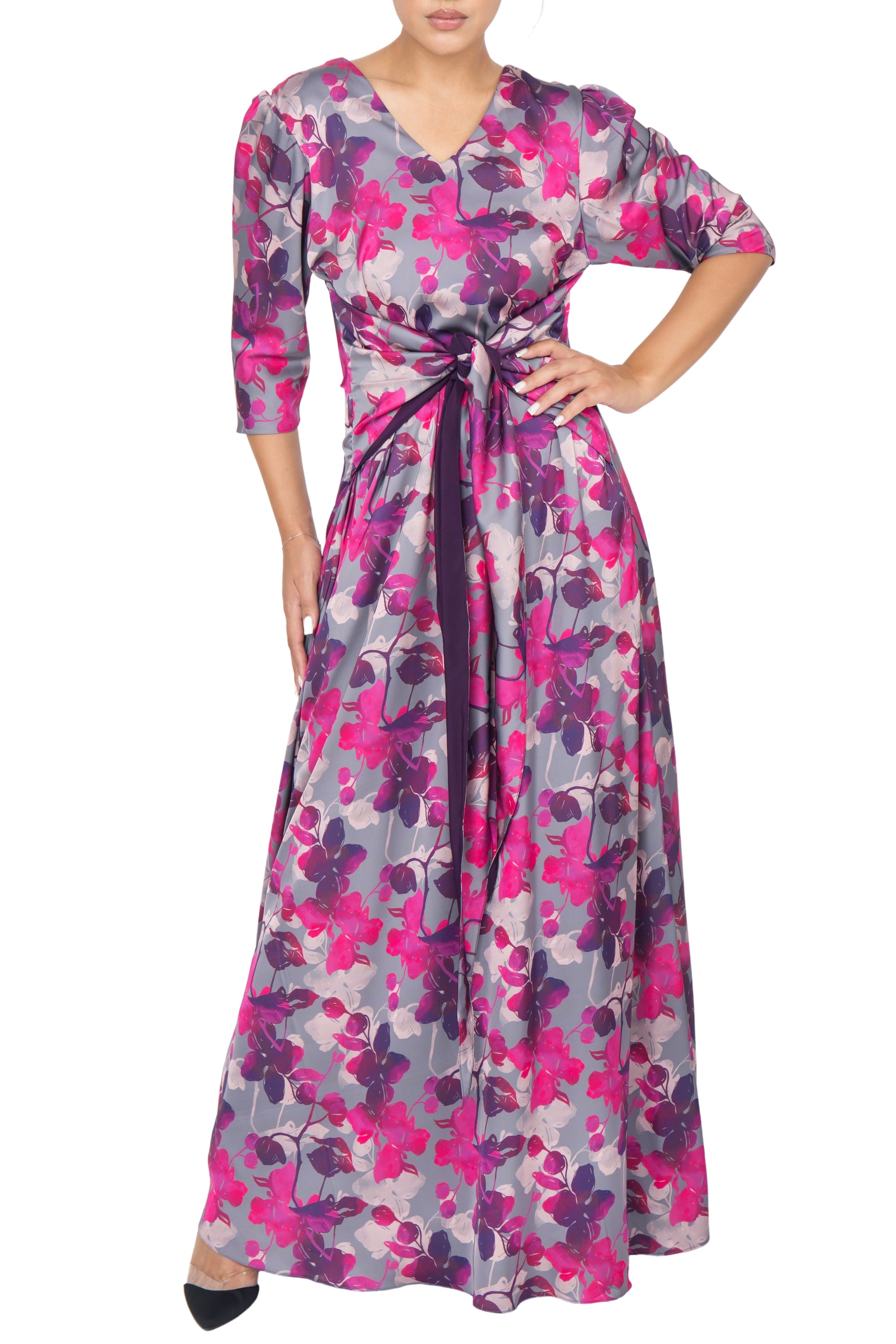 Versatile silk dress with pink and purple floral print can be tied in the center for a classic look