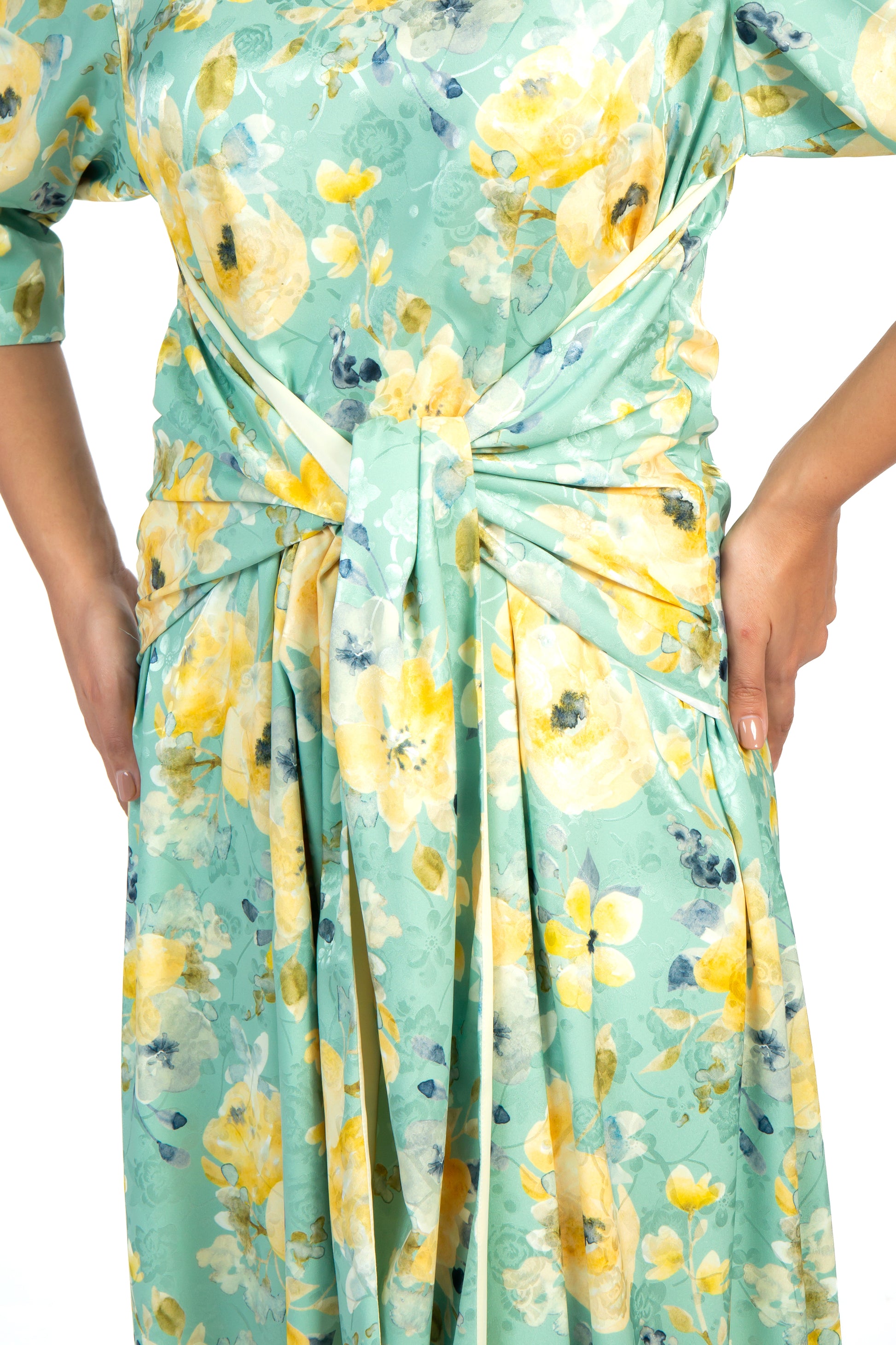 Green and yellow floral silk dress worn with a denim jacket and sandals