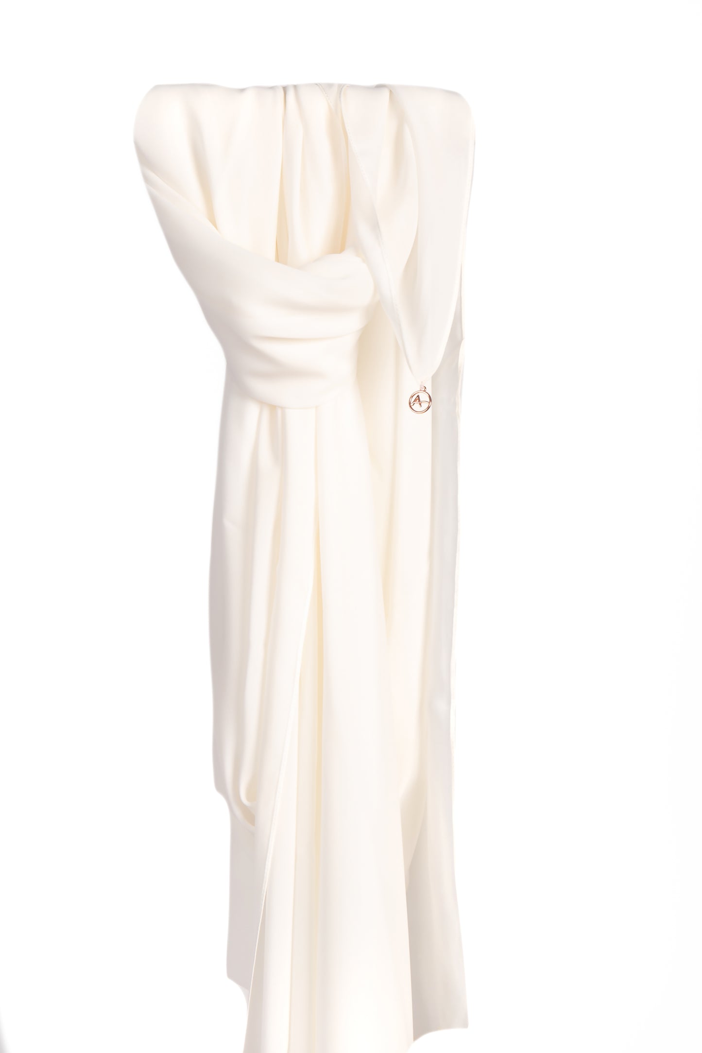 Image of an ivory silk chiffon shayla, draped elegantly with a soft and silky texture, showcasing its delicate and luxurious fabric and elegant ivory color