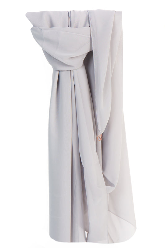 Image of a dove grey silk chiffon shayla, draped elegantly with a soft and silky texture, showcasing its delicate and luxurious fabric and understated grey hue.