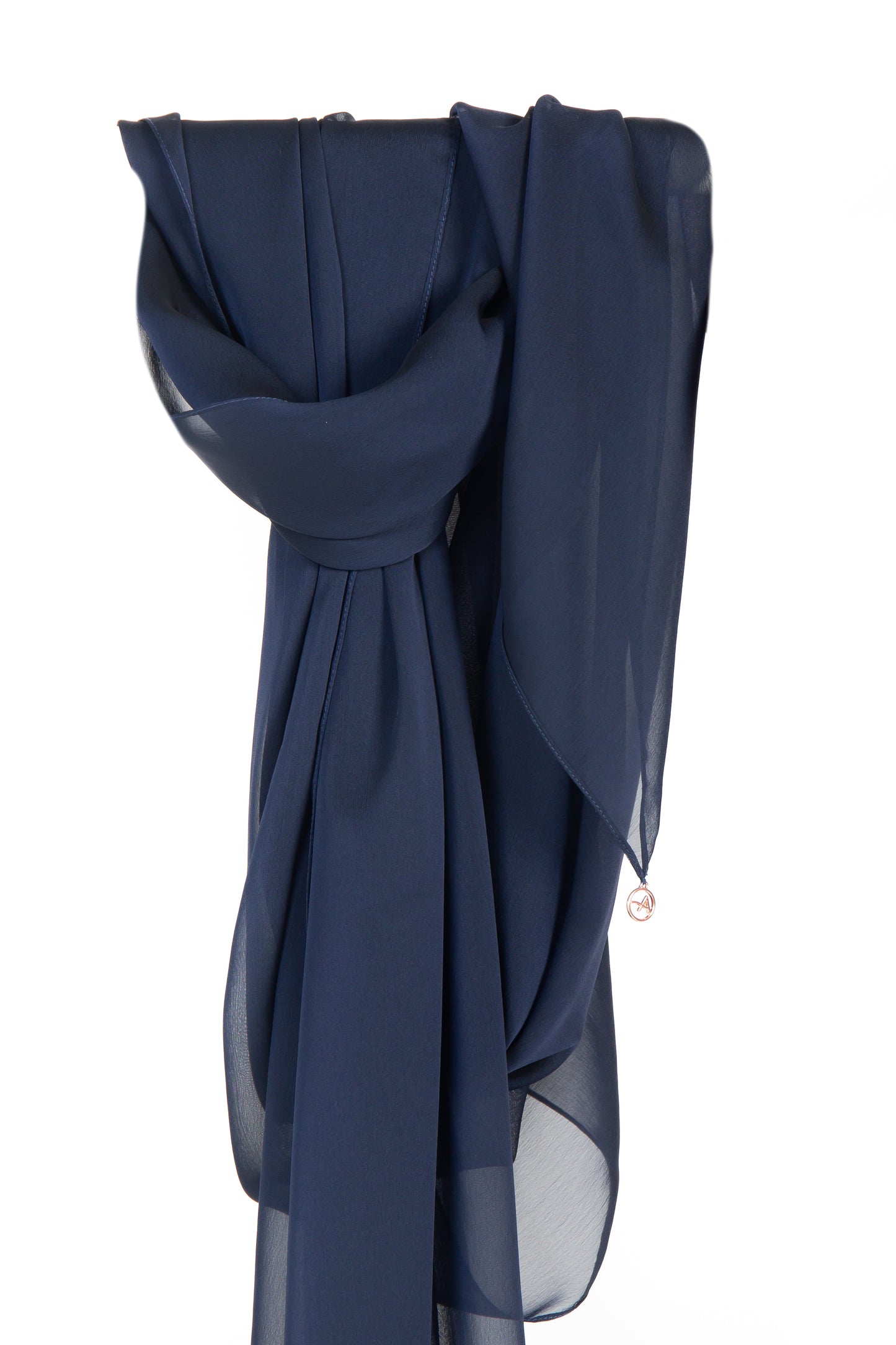 Image of a navy blue silk chiffon shayla, draped elegantly with a soft and silky texture, showcasing its classic and timeless navy hue